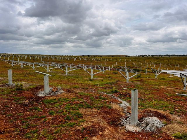 Foundation piers across an open field