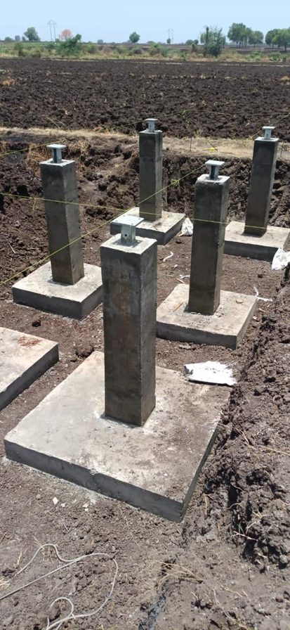 Concrete foundation piers with anchor plates